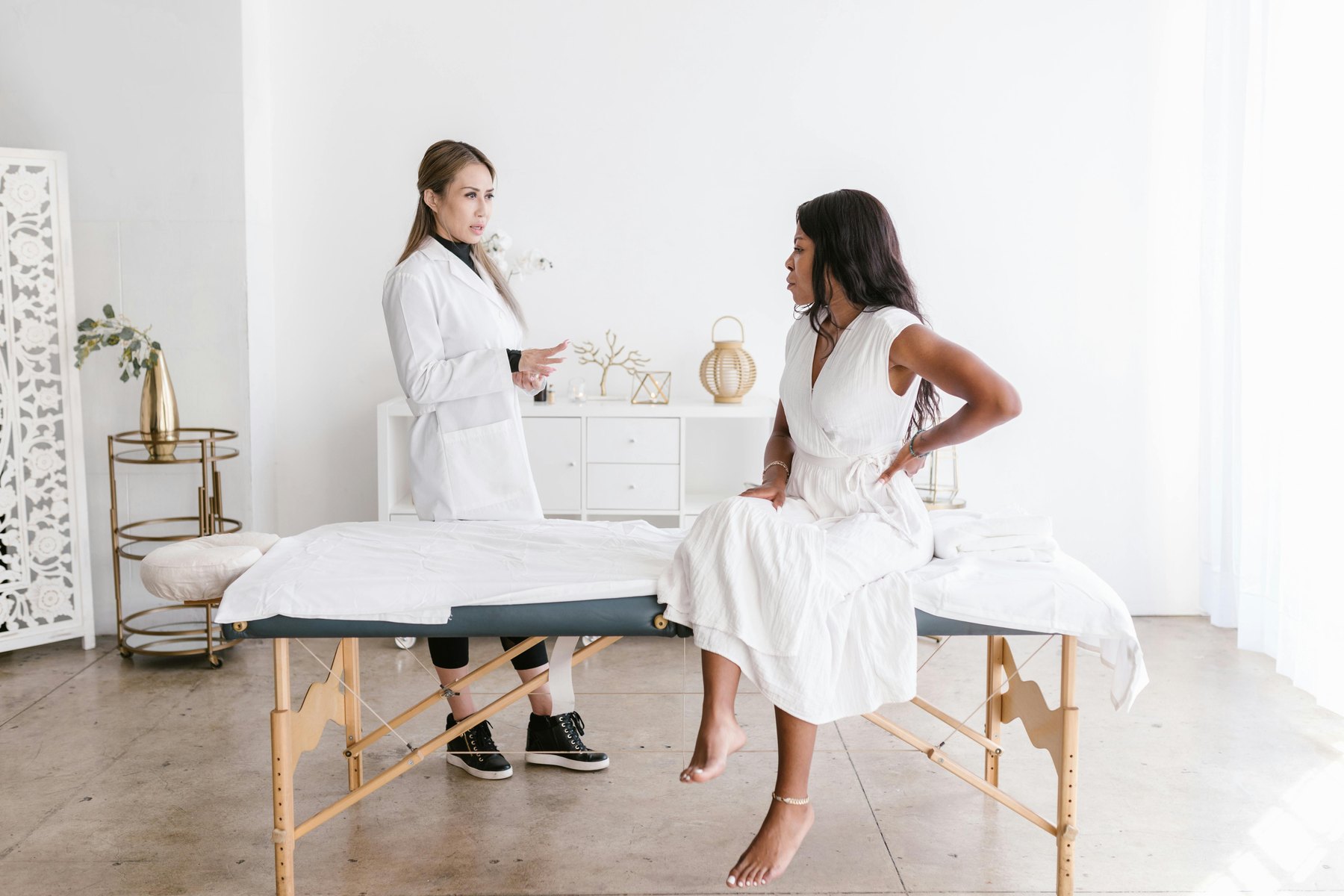 Practitioner speaking with a patient during a consultation